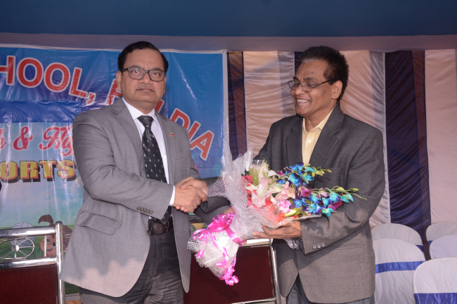 Principal Sir presenting bouquet to Honorable Chief Guest Shri C.K. Tiwari Executive Director, IOCL Haldia Refinary