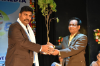 PRINCIPAL SIR PRESENTING SAPLING TO THE HONORABLE GUEST 